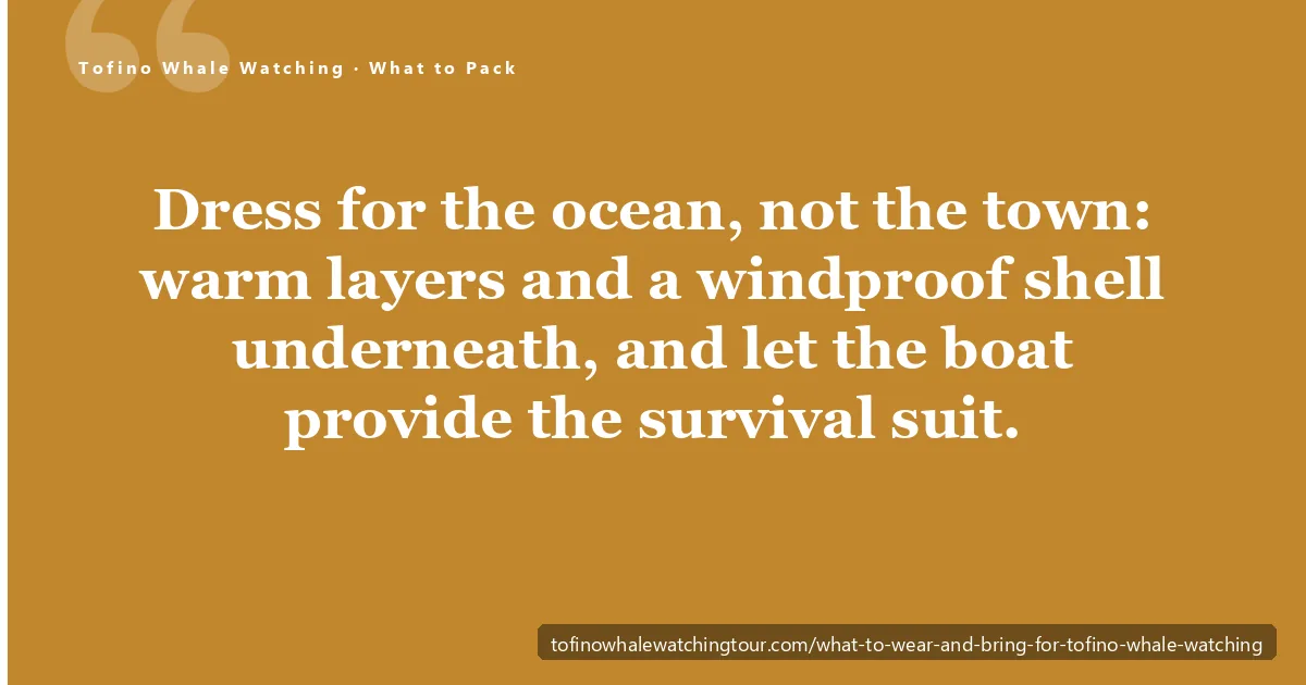 What to wear for Tofino whale watching — a guest in warm layers and a windproof shell on a Clayoquot Sound boat